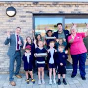 Pupils from Sprowston infant and junior school helped to fill time capsules at new care home