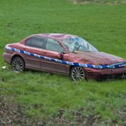 An abandoned car in a field near Norwich