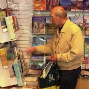A member of the public looking round the tourist information centre in the Forum