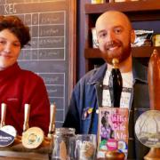 The Malt and Mardle has raised funds for an LQBTQ+ heritage group. Pictured is  barkeeper Izzie, left, and Queer Norfolk project founder Adam
