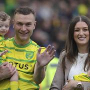 Norwich City defender Ben Gibson with his family on the pitch at Carrow Road at the end of the season