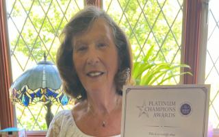 Marion Billham, 80, of Brundall, with her Platinum Champion Awards certificate