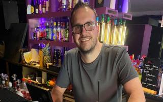 Andre Smith, owner of Cans 'N' Cocktails bar on Norwich's Prince of Wales Road with StopTopps which are a preventative anti-drink spiking measure