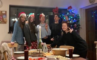 Kseniia Filipchuk, second from right, celebrating Christmas with friends she has made in Norfolk since arriving from Ukraine